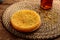 KUNAFA with honey served in a mat isolated on wooden background side view dessert