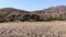 Kunene river with mountain range at the end of Marienfluss valley