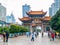 KUNMING, CHINA - SEPTEMBER 9, 2012: Kunming Archway. Traditional chinese gate and modern buildings of downtown, Kunming