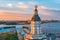 Kunstkamera at sunset on a summer evening and in the background Rostral columns on the Spit of Vasilyevsky Island and the Peter