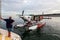 Kununurra, WA. Australia - May 18, 2013: A Cessna 208 Caravan Amphibious Float plane disembarks passengers after landing on the