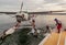 Kununurra, WA. Australia - May 18, 2013: A Cessna 208 Caravan Amphibious Float plane disembarks passengers after landing on the