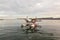 Kununurra, WA. Australia - May 18, 2013: A Cessna 208 Caravan Amphibious Float plane lands on the still waters of Lake Argyle