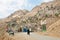 Kurdish man walk on rural road from the old mountaine village in Middle East.