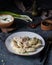 Kurze from Dagestan with meat on a plate on a dark table.