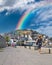 Kusadasi, Aydin, Turkey - August 22, 2021: Colorful Kusadasi houses on the hill with rainbow