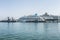 Kusadasi, Turkey, 05/19/2019: Large beautiful cruise ships stand in the port. Turquoise sea and clear blue sky on a sunny day.