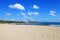 Kuta Beach with blue sky in Kuta, Bali, Indonesia.