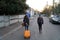 KUTAISI, GEORGIA - 11 11 2018: Two teenagers travel with their luggage, one with a suitcase and the other with a backpack