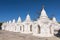 Kuthodaw Pagoda contains the worlds biggest book. There are 729 white stupas with caves with a marble slab inside page with