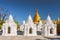 Kuthodaw Pagoda contains the worlds biggest book. There are 729 white stupas with caves with a marble slab inside page with