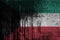 Kuwait flag depicted in paint colors on old and dirty oil barrel wall closeup. Textured banner on rough background
