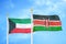 Kuwait and Kenya two flags on flagpoles and blue sky