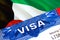 Kuwait Visa in passport. USA immigration Visa for Kuwait citizens focusing on word VISA. Travel Kuwait visa in national