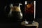 Kvass drink in a dark low key kvass drink in an iced glass and a jug with a drink with room for text