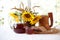 Kvass (kvas) in a wooden mug, bread and a bouquet of sunflowers