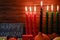 Kwanzaa African American holiday. Seven candles on wooden background.