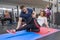 Kyiv UA, 28-03-2019. Mature woman doing sport exercises with personal trainer at gym. Male instructor assisting older woman