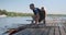 Kyiv UA, 31-07-2019. Young sports team two teenage boys with a double boat kayak on the water.