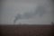 Kyiv, Ukraine - 03/23/2022: Black smoke on the horizon from destroyed Russian military equipment