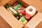 Kyiv / Ukraine - 04.18.2020: Various canned food, pasta and cereals in a cardboard box. Food donations or food delivery concept in