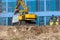 Kyiv Ukraine - April 06 2020: Excavator loader and dump truck during earthworks at a construction site.