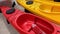 Kyiv, Ukraine - August 16, 2020: Collection of vibrant colorful plastic recreational canoe and kayaks Kolibri One-GO at store at K