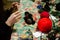 Kyiv, Ukraine - February 14, 2022. Children make products from threads. Teenage caucasian girls make crafts. Master class for