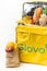 KYIV, UKRAINE - January 17: Glovo thermal yellow food bag full of products from the grocery store isolated on white background.