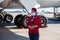 Kyiv, Ukraine - July 1, 2020: Turkish Airlines flight attendant standing near airplane engine. Boeing 787 Dreamliner engine.