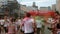 Kyiv/Ukraine - June 2, 2019 - Back view of charming female and male runners in white clothes are jogging under inflatable arch at
