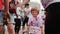 Kyiv/Ukraine - June 2, 2019 - Cute little boy stained with colorful paint with number of participant of race smiling to camera at