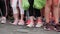 Kyiv/Ukraine - June 2, 2019 - Side view of little children legs in sneakers preparing for race at starting line at Color Run