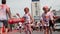 Kyiv/Ukraine - June 2, 2019 - Two cute little girls stained in colorful fluorescent indian holi paints supporting young happy fema