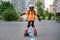KYIV, UKRAINE JUNE 26, 2018: Attractive teenage girl roller skating on roller blades