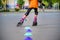 KYIV, UKRAINE JUNE 26, 2018: Attractive teenage girl roller skating on roller blades
