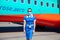 Kyiv, Ukraine - June 27, 2020: A flight attendant and a stewardess in a medical mask. Plane Windrose airline prepares to take