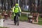 Kyiv Ukraine - March 28 2020: A young man in a protective mask from viruses rides a bicycle in the park.