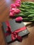 Kyiv, Ukraine March 7 2018, SPELL CHOCHOLATE hand made sweets in a dark box, decorated with tulips. Women`s day holiday celebratio