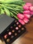 Kyiv, Ukraine March 7 2018, SPELL CHOCHOLATE hand made sweets in a dark box, decorated with tulips. Women`s day holiday celebratio