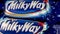 Kyiv, Ukraine, May 2022: - Wrapped chocolate bar Milky Way popular mini candy made by Mars, Incorporated rotate slowly.