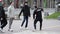 Kyiv, Ukraine - May 3, 2021. Guys dance on the streets of the city. Group of young street performers dancing on the sidewalk.