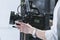 Kyiv, Ukraine - November, 2020: Close-up of male hand holding video camera Black Magic pocket cinema 4k with Carl Zeiss lens