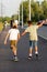 Kyiv, Ukraine - September 01, 2019. Krushelnitskaya St. Two active teens on roller skate and skateboard riding outdoors