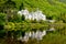 Kylemore Abbey with water reflections in Connemara, County Galway, Ireland, Europe. Benedictine monastery founded 1920