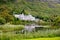 Kylemore Abbey with water reflections in Connemara, County Galway, Ireland, Europe. Benedictine monastery founded 1920