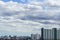 Kyline under blue sky with scenic fluffy clouds