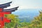 Kyoto cityscape from Inariyama mountain with a red torii gate.