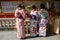 KYOTO, JAPAN- APRIL 03, 2019: Japanese girls in kimono dress in front of Jinja-Jishu shrine in Kyoto, Japan