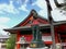 KYOTO, JAPAN - APRIL, 16, 2018: fox statue holding a rice sheaf at fushimi inari temple in kyoto